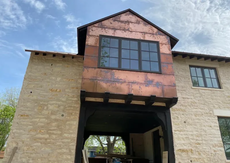 Copper metal panel facade on a stone building for Skylight Installation in Liberty Lake