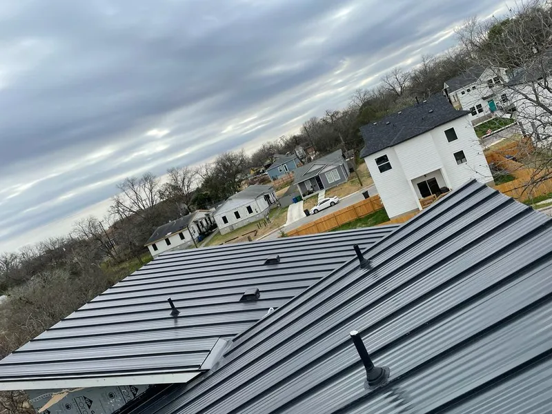 Standing seam metal roof panels with vents for Skylight Repair in Liberty Lake